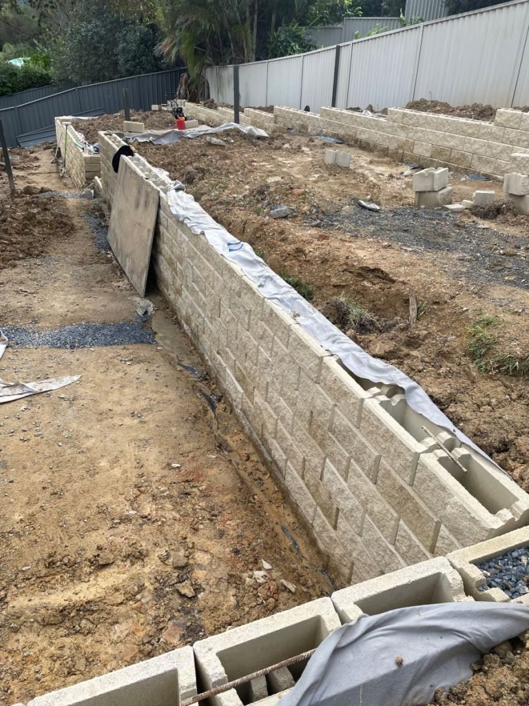 Excavator Hire Coffs Harbour Changing levels in Korora for a retaining wall and drainage
